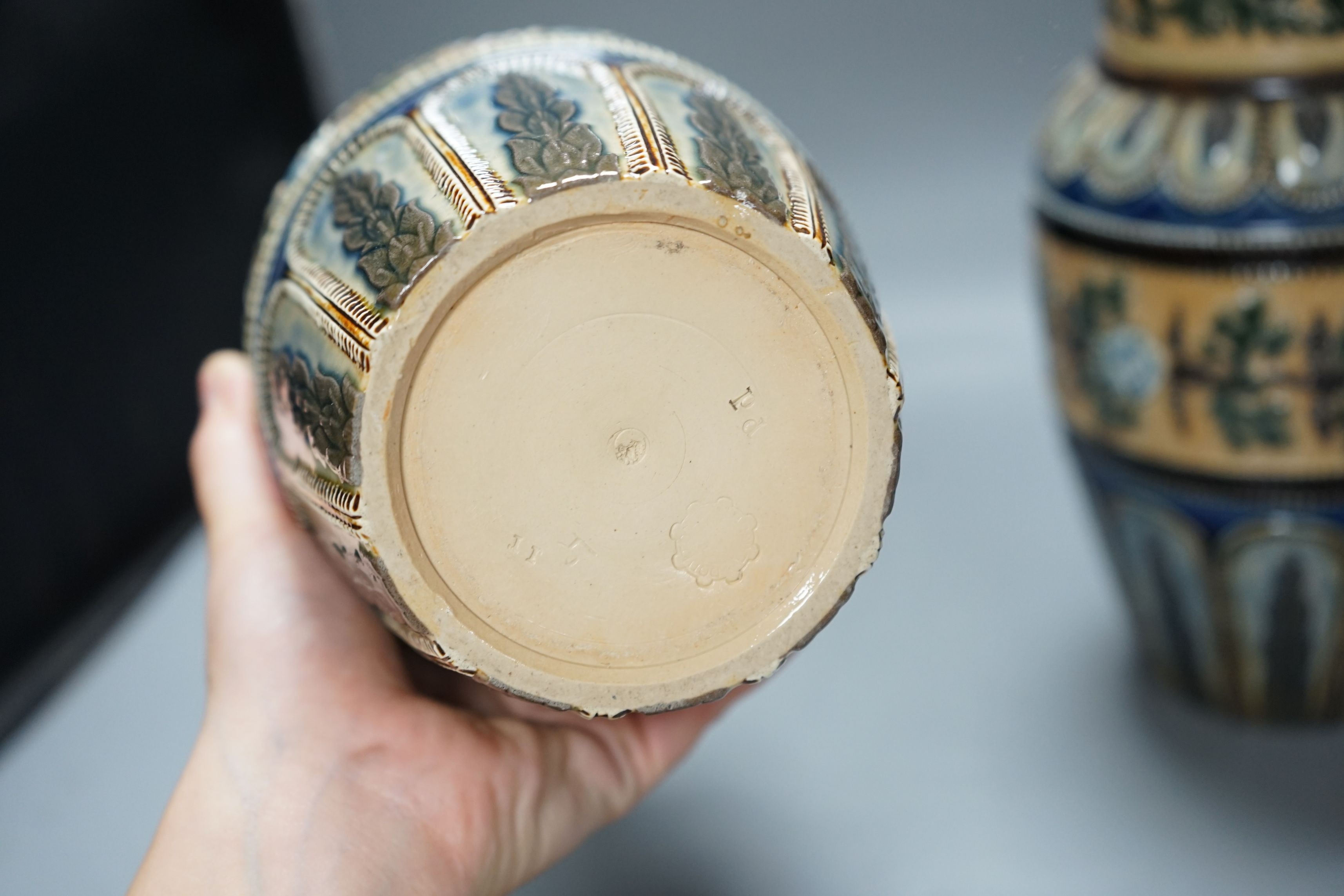 A pair of Doulton Lambeth vases, c.1885, 25.5cms high